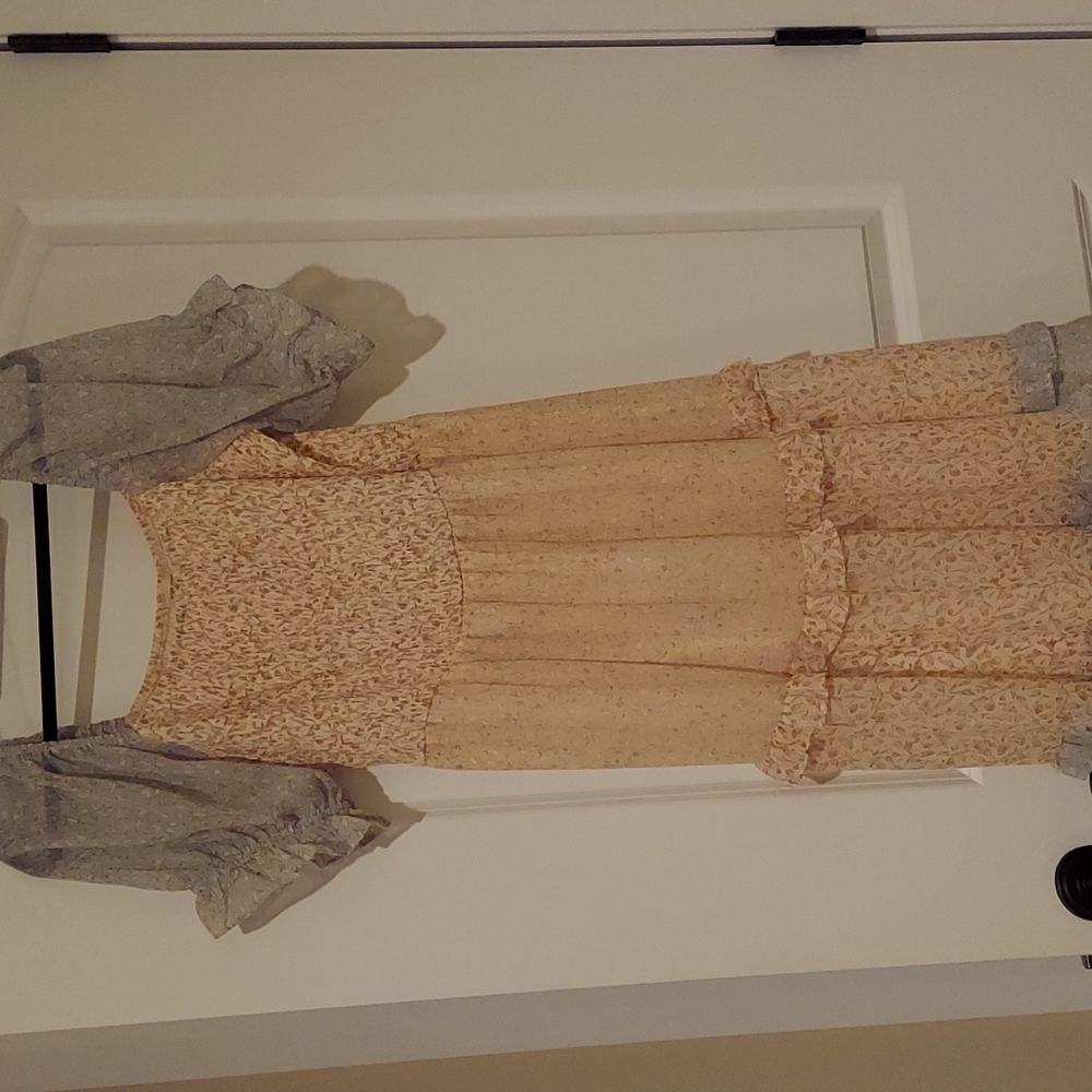 Brand new Orange Creek puffed sleeved light and beautiful dress.